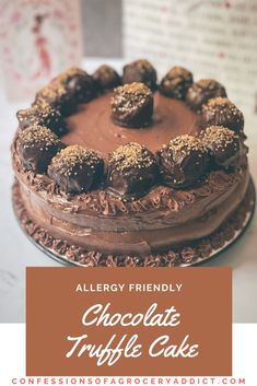 a chocolate truffle cake on a table with the words allergy friendly above it