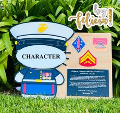 a wooden sign with an air force character on it's side in the grass