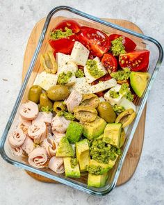 a glass dish filled with different types of vegetables