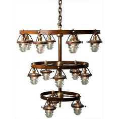 an old fashioned chandelier hanging from a chain with several lights on top of it