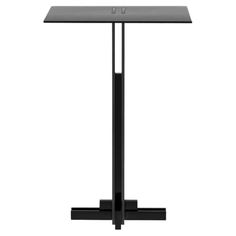 a black table with a glass top and two legs on each side, in front of a white background