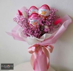 a bouquet of flowers with eggs in it