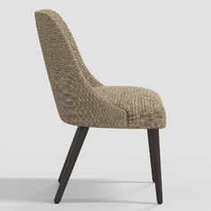 an upholstered chair with wooden legs and a beige fabric seat pad on the back