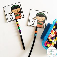 two children's beaded necklaces with numbers on them, one for each child