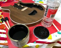 the guitar is being painted and ready to be used