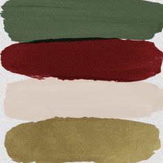 four different shades of green, red, and gold paint on white paper with the same color