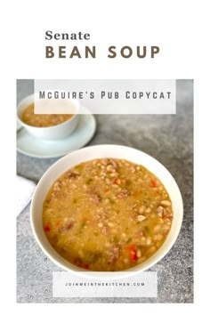 a white bowl filled with soup on top of a table next to another bowl full of soup