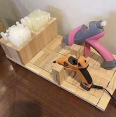 a couple of tools sitting on top of a wooden table next to some soaps