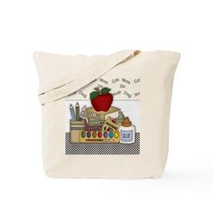 a tote bag with an apple and school supplies on it