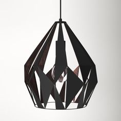 a black and white geometric light hanging from a ceiling