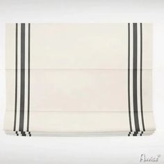 a white and black striped roman blind