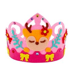 a pink and yellow crown with flowers on the top, sitting in front of a white background