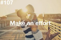 a man and woman are kissing on the pier with the sun shining behind them, which reads make an effort