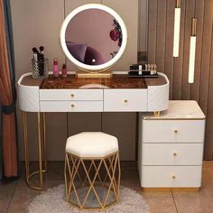 a vanity table with a stool and mirror