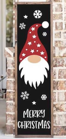 a christmas door hanger with a santa clause on it