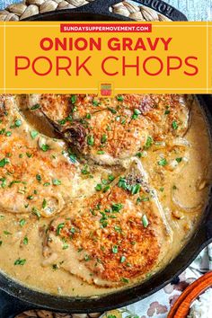 an iron skillet filled with pork chops covered in gravy