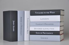 four books stacked on top of each other in front of a gray background with the title voicings to the west