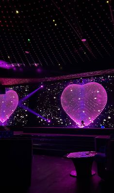 two heart shaped lights in the middle of a room