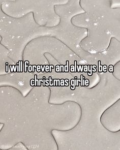 the words i will forever and always be a christmas girl lie on top of snow