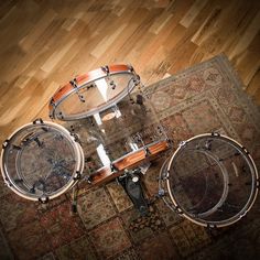 a drum set sitting on top of a wooden floor