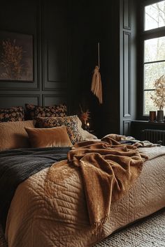 Velvet throws and patterned quilts adding texture to a dark boho bedroom. Dark And Moody Boho Bedroom, Dark Cozy Aesthetic Bedroom, Rich Earthy Aesthetic, Green Brown Bedroom Ideas, Cozy Bedroom No Windows, Dark Walls Master Bed, Burgundy Boho Bedroom, Anthropology Bedroom Inspiration, Vintage Dark Academia Bedroom