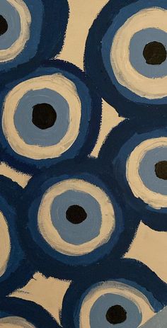 an abstract painting with blue and white circles