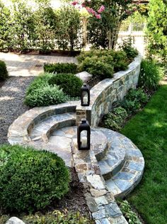 an outdoor garden with stone steps and plants