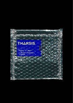 the packaging for tharis is shown on a black background with blue and white lettering