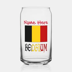 a glass with the words name here and belgium in red, black, yellow and green