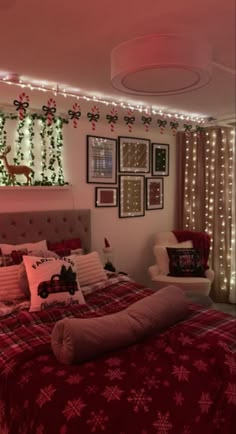 a bed room with a neatly made bed and christmas decorations on the wall above it