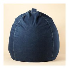 a blue bean bag sitting on top of a white floor