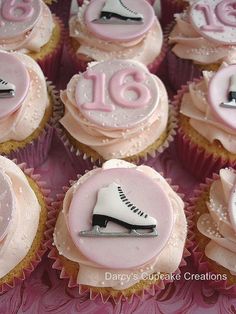 cupcakes decorated with pink frosting and white icing