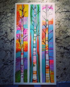 an art project with trees painted on paper