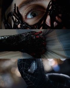 the amazing spider - man is being held up by someone's hands and his eyes are open