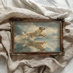 a painting of a golden retriever flying through the sky with clouds in it's reflection