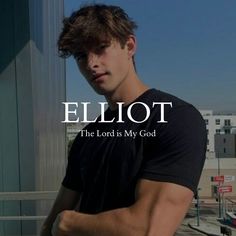 a young man standing in front of a tall building with the words elliot on it