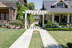 a house with a walkway leading to the front door