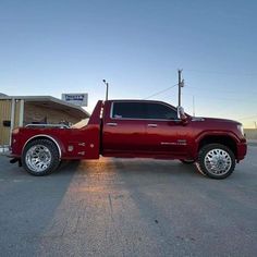 a large red truck parked in a parking lot