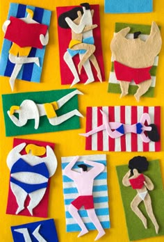 some paper cut out of different types of people and objects on a yellow surface with red, white, and blue stripes