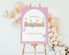 a welcome to babyland sign in front of balloons