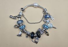 Its a boy theme pandora style bracelet ,baby boot, heart, baby feet, bottle, boy, feet, pacifier,  blue silver colors Pandora Style Bracelet, Its A Boy, Pandora Style, Bracelet Style, Baby Boots, A Boy, Charm Bracelets, Blue And Silver