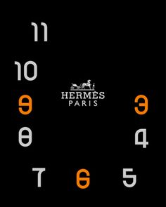 an orange and white clock with the words hermes paris on it's face in front of a black background