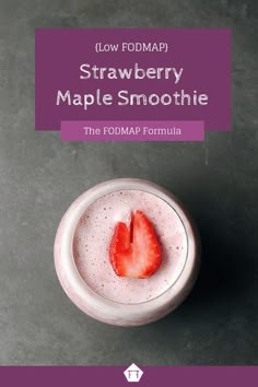 a strawberry in a glass with the text low fodmap strawberry maple smoothie