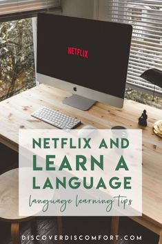 a desk with a computer on it and the words netflix and learn a language in front of