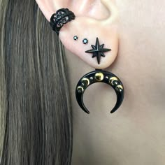 Two tonal Moon phase with Star earrings are made of 316L Stainless steel . Earrings are worn as ear jacket . Can be worn as a star, without the back part. Earring has 2 height setting to fit any earlobe. Post: 0.8mm /21G -Regular post  Width of Moon : 22mm Star stud: 12mm Listin for 1 pair (2 earrings) Ships in a gift box Gothic Ear Piercings Aesthetic, Magic Earrings, Star Ear Piercings, Witchy Ear Piercings, Celestial Crescent Cartilage Earrings, Moon Themed Outfits, Black Crescent Moon Charm Earrings, Black Moon Shaped Celestial Earrings, Black Moon-shaped Pierced Earrings