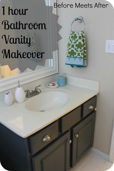 a bathroom sink with two towels hanging on it's rack and the mirror above it