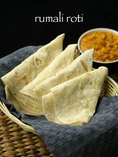 some tortillas are sitting on a wicker basket