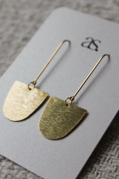 14k gold-plated earring post + brushed brass charm Handmade Hoop Earrings Ideas, Nickel-free 14k Gold-filled Gold-tone Jewelry, Recycled Gold Dangle Jewelry, Gold-tone 14k Gold Earrings As A Gift, Minimalist Recycled Gold Dangle Jewelry, Single Drop Earring In Recycled Gold, Modern Gold Dangle Jewelry, Everyday Yellow Gold Dangle Earrings, Everyday Matte Gold Tarnish-resistant Jewelry