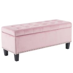 a pink bench with studded legs and an upholstered cushion on the top