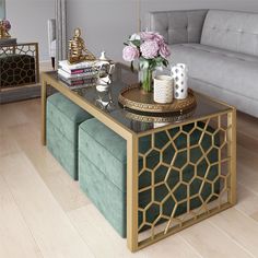 a coffee table with two stools on it and a couch in the back ground